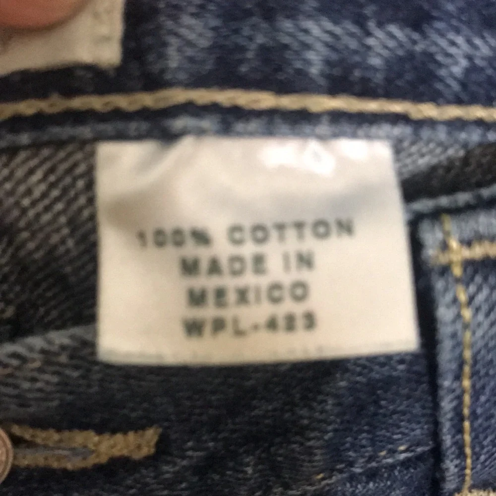 Levi’s 501 button fly Jeans size 35x28 (tag size 36x34) lightly distressed